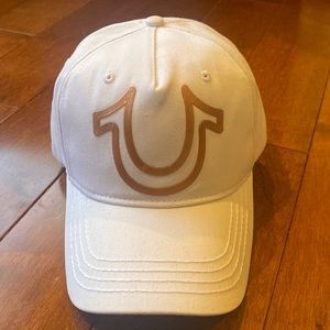 True Religion hat. Unisex New Without Tags. White with gold horseshoe